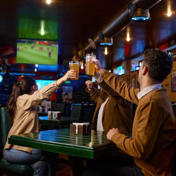 friends-watching-football-match-translation-clinking-beer-mug-excited-diverse-hopeful-fans-rest-sport-bar_266732-31727